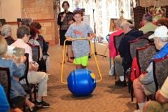 A religious school student demonstrates a water transport tool
